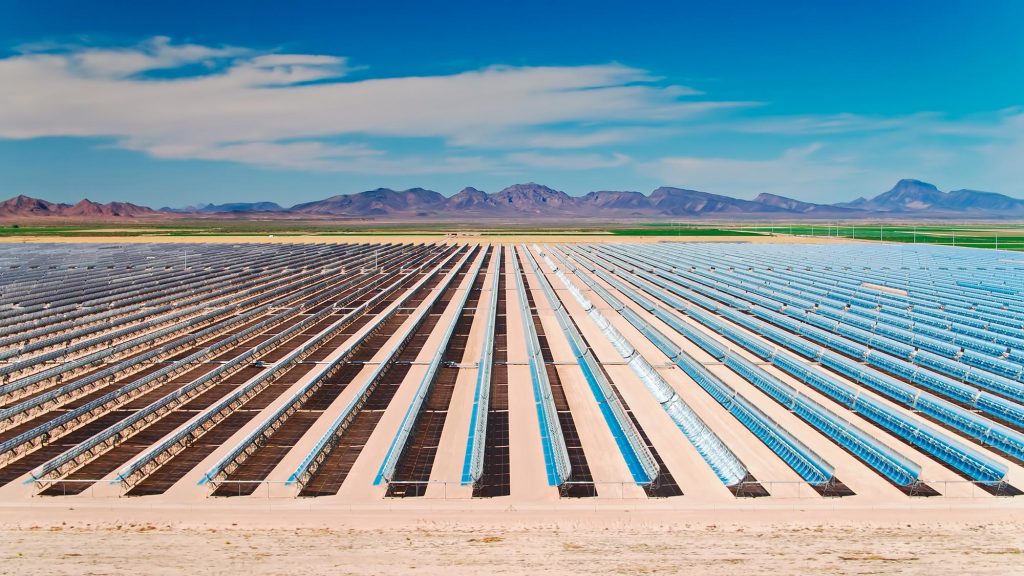 Grid of solar panels on an open field